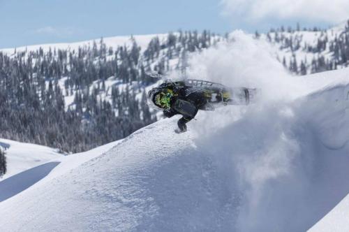 Duncan Lee jumping on snowmobile