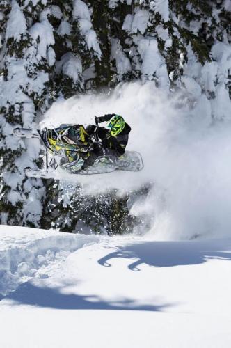 Duncan Lee jumping on snowmobile