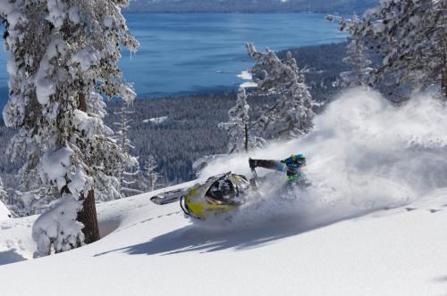 Duncan Lee riding snowmobile in Lake Tahoe