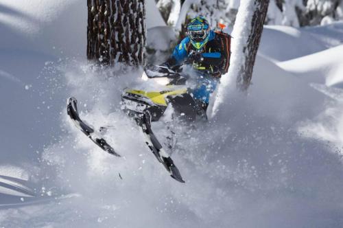 Duncan Lee riding snowmobile