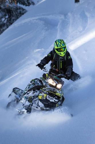 Duncan Lee riding snowmobile