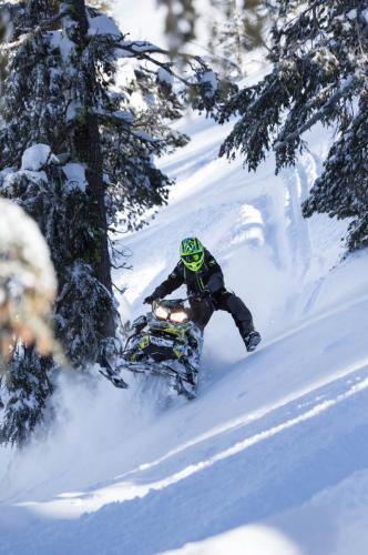 Duncan Lee riding snowmobile