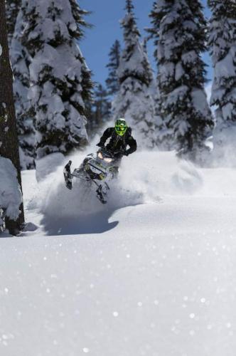 Duncan Lee riding snowmobile