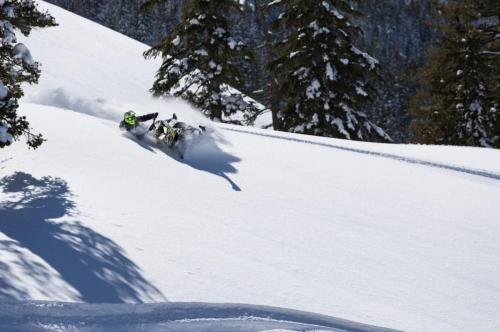 Duncan Lee riding snowmobile